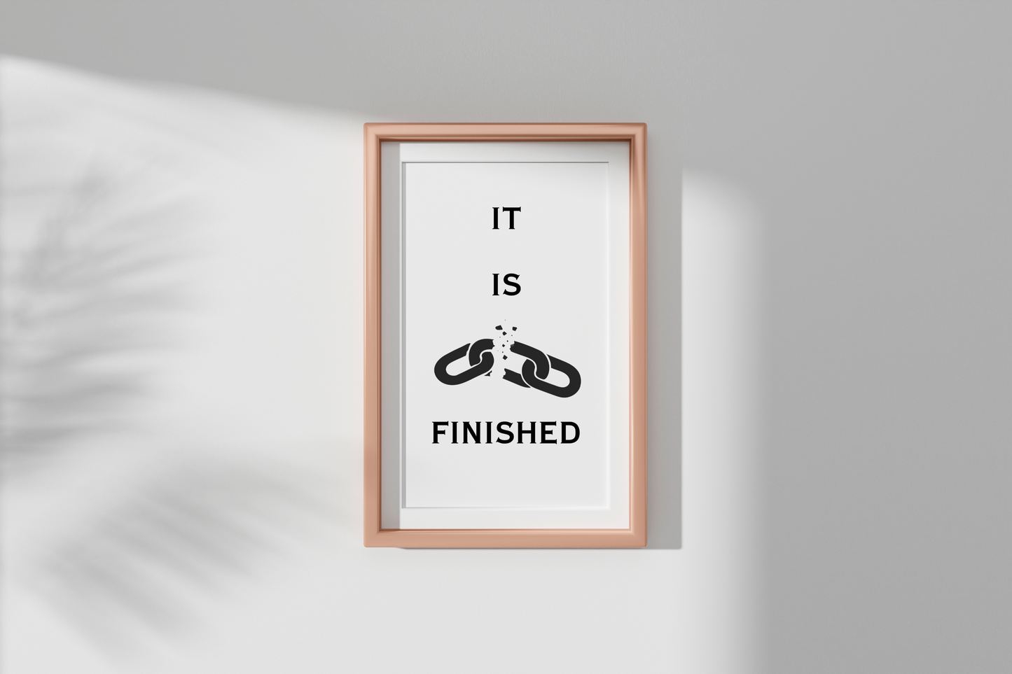 Framed artwork with 'IT IS FINISHED' text on a white background
