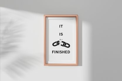 Framed artwork with 'IT IS FINISHED' text on a white background