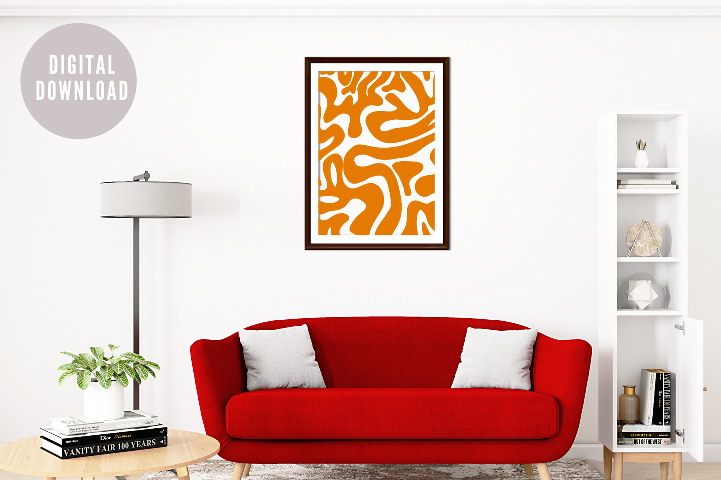 Colourful abstract art wall print above red sofa