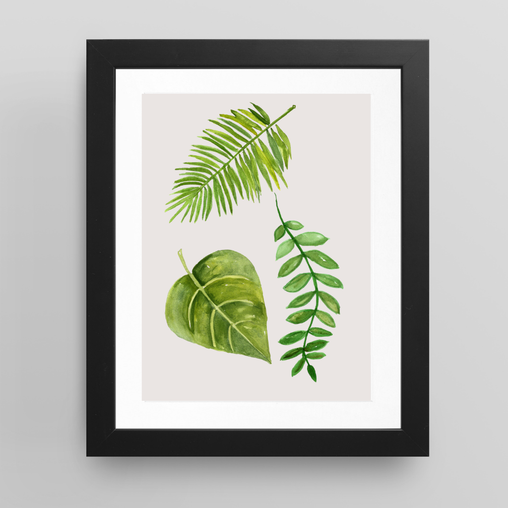 Green watercolour leaf wall art displayed in a neutral kitchen interior