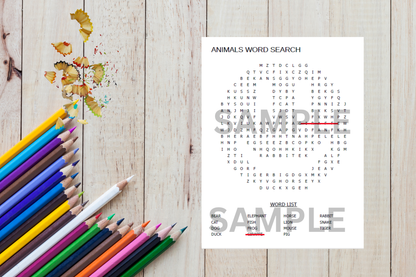 Animals word search sheet with colored pencils on a wooden surface