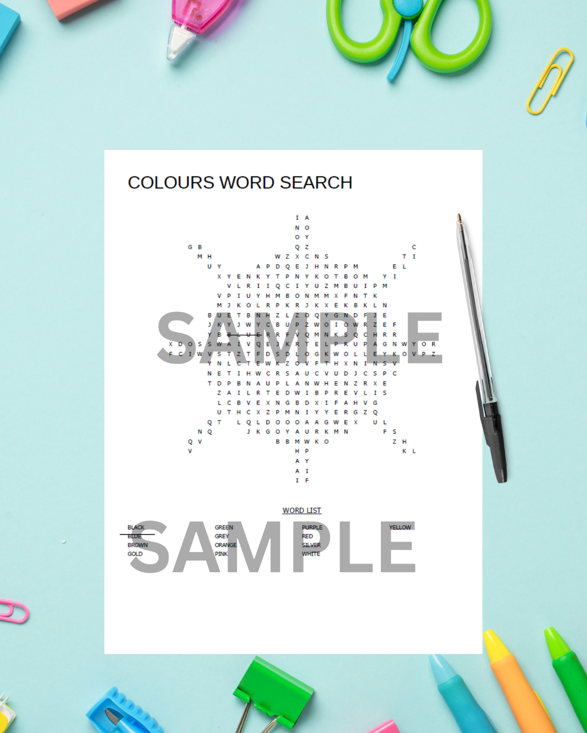 Printable colours word search puzzle for kids on a bright school desk with pencils and crayons.