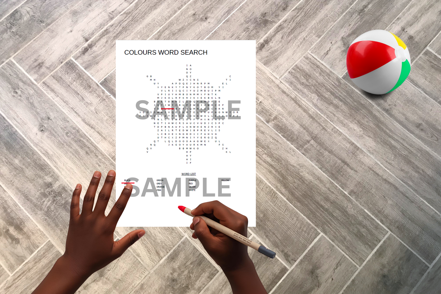 Sun-shaped word search printable displayed on a wooden home floor with a child solving the puzzle