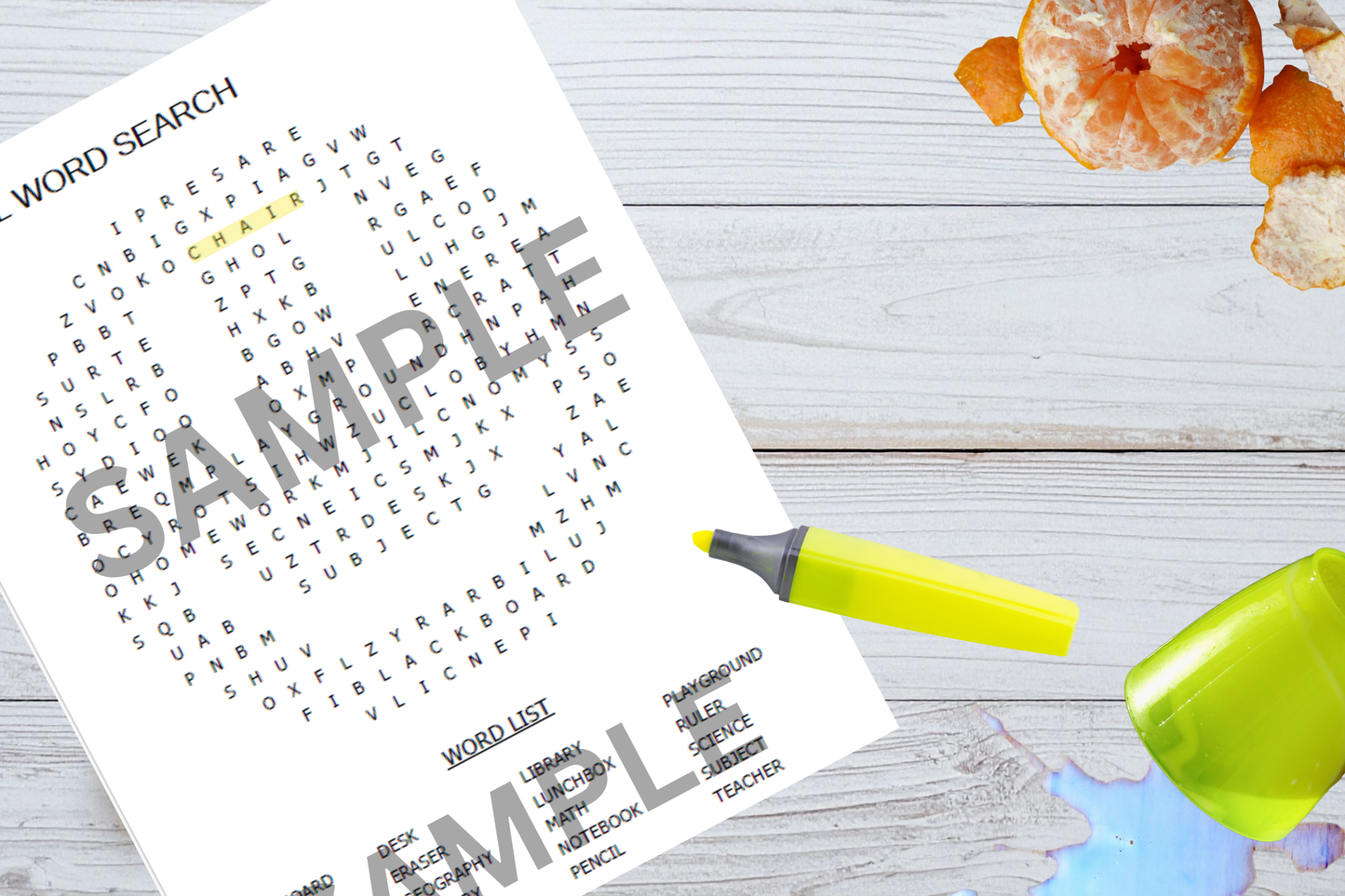 Smiley face word search printable activity sheet displayed on a wooden home table with highlighter pen.
