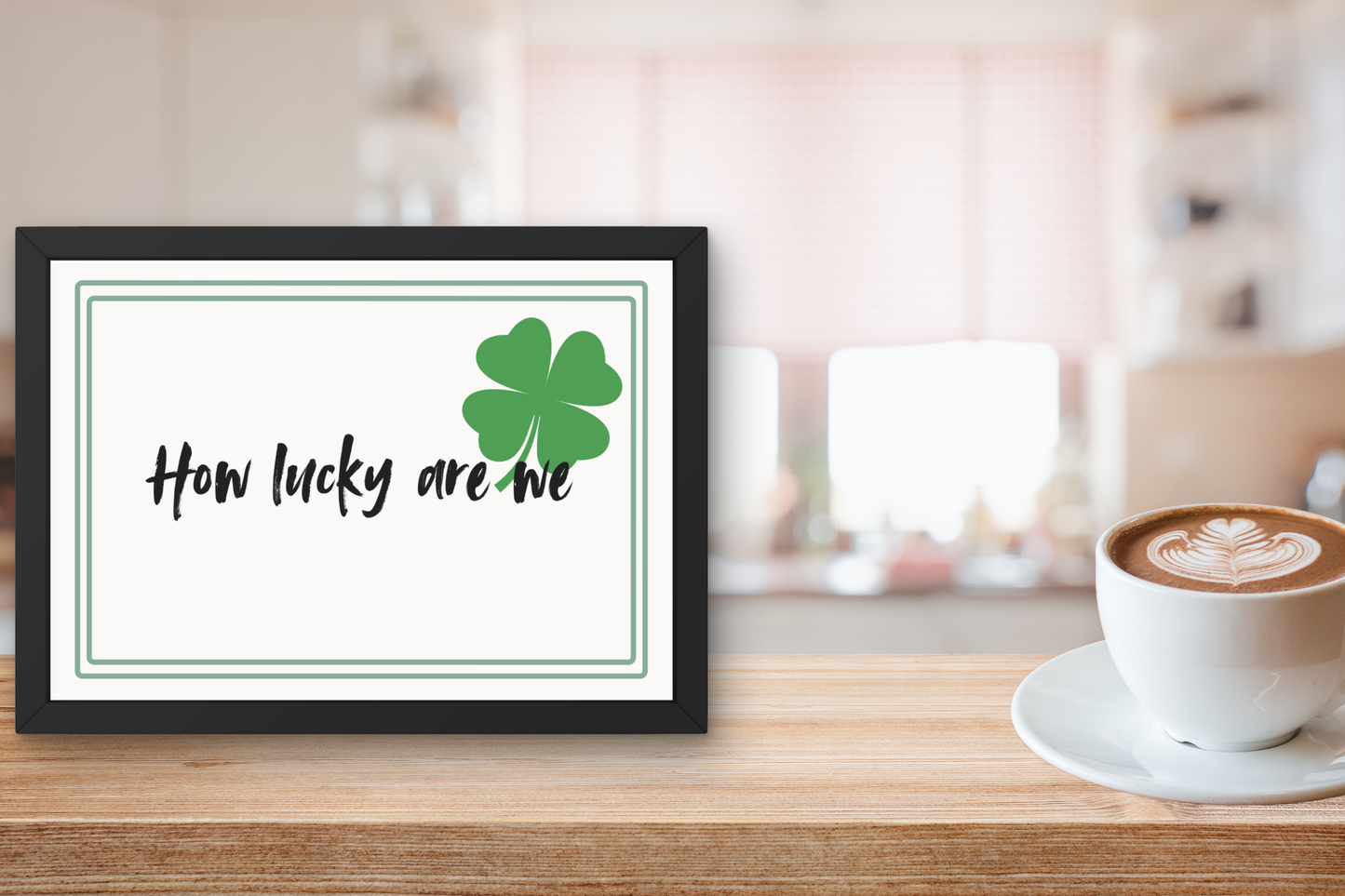 Minimalist gratitude wall art with four leaf clover detail on kitchen counter 
