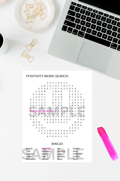 Printable word search puzzle for adults placed on a tidy office desk with a laptop, highlighter pen, and coffee cup.

