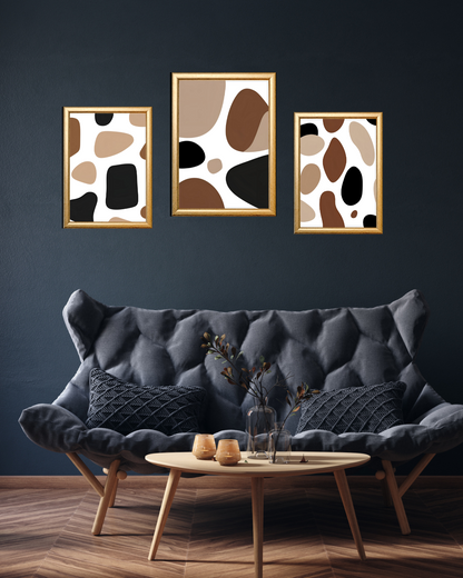 brown and black abstract wall art prints above sofa