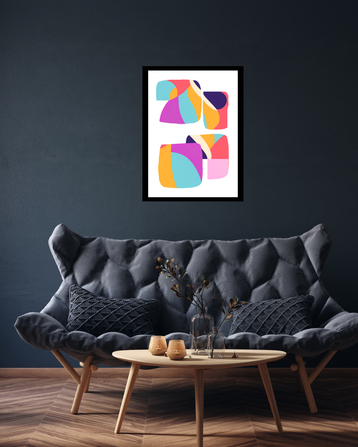 Modern maximalist wall art with bold shapes above sofa in lounge.