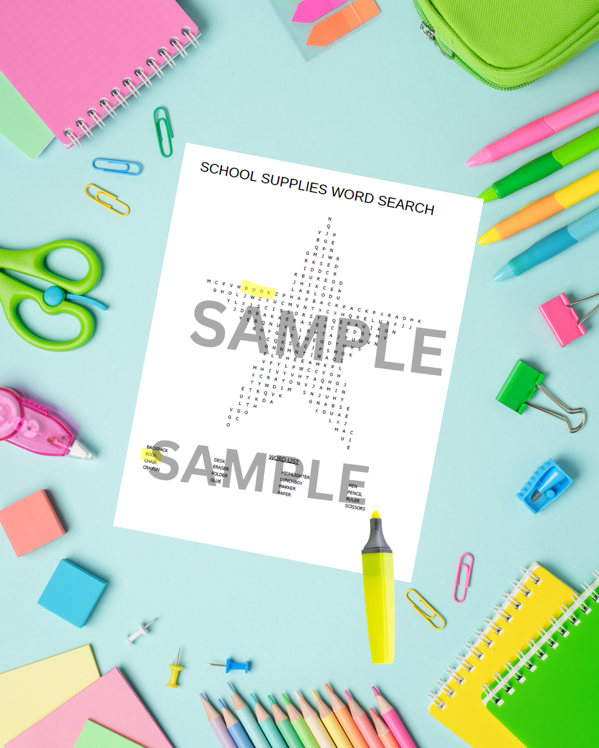 School supplies word search printable in star design on a classroom desk with pencils and rulers.