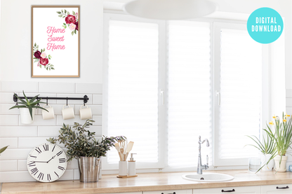 Modern kitchen interior with a 'Home Sweet Home' decorative print, clock, and plants.