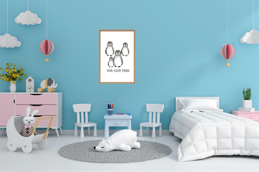 Penguin family printable nursery décor above children’s bed