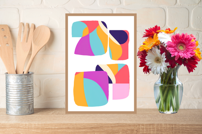 Colourful statement wall art decor-geometric art print on a kitchen counter with wooden utensils and flowers.