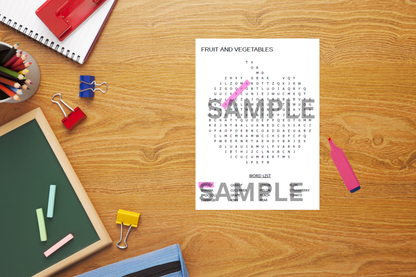 Sheet of paper with a word search puzzle titled 'Fruit and Vegetables' on a wooden desk with stationery items.